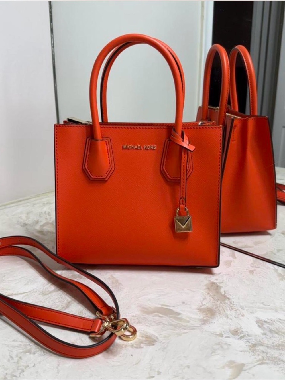 Gorgeous Michael Kors Orange
Purse with Gold Hardware